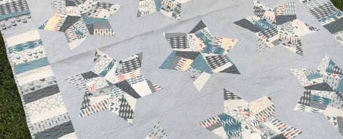 Splendid Stars Quilt - "made fabric" stars set in a soft grey background - amyscreativeside.com
